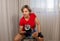 Woman at home lifting weights by herself to stay in shape