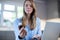 Woman At Home Looking Up Information About Medication Online Using Laptop