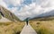 Woman in Hooker Valley Track. Mount Cook National Park. New Zealand