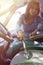 Woman hoovering a seat in car