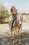 Woman with a horse at field, lifestyle and hobby