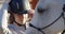 Woman, horse and helmet at ranch, farm and ready for riding, training and smile for adventure in summer. Cowgirl