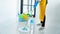 Woman housekeeper with mop and bucket with cleaning agents for cleaning floor at home, Floor care and cleaning services