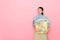 Woman houseworker standing in pink background