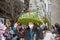 Woman in huge garden themed hat in Easter Bonnet Parade