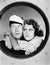 Woman hugging sailor at porthole