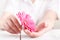 Woman hygiene conception. Pink flower gerbera in female hands