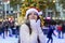 Woman on a ice rink on a Christmas market