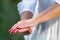 Woman immersed in yoga and meditation by the water, focusing on her hands. Experience tranquility in this serene moment of mindful