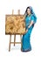 Woman in Indian turquoise sari with pyrography painting