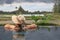 Woman in infinity pool with rice fields view