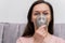 The woman inhales the respiratory tract and lungs when applying drugs. A woman breathes through a face mask using a nebulizer