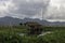 A woman in Inle Lake makes repairs to her house on stilts in the middle of the lake