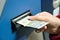 Woman Inserting Cash Into Machine