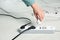 Woman inserting power plug into extension cord on floor. Electrician`s professional equipment