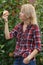 Woman inspecting an apple