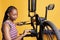 Woman Inspecting Bike for Smooth Cycling