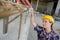 woman inspecting renbars on construction site