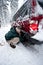 Woman installing tire chains