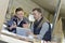 Woman and instructor in carpentry workshop