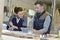 Woman and instructor in carpentry workshop