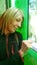 woman intent on buying on a vending machine.