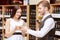 Woman interacts with a sommelier in shop