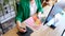 Woman interior designer working with fan of colourful samples in office