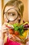 Woman investigating shopping backet with vegetables