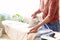 Woman ironing garment at home