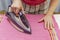 Woman ironing linen underwear, closeup