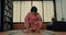 Woman, Japanese and traditional spiritual respect in Chashitsu room for ritual, gratitude or wellness. Asian person