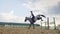 A woman jockey jumps over the barriers on a horse in a jumping competition, slow motion