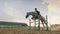 A woman jockey jumps over the barriers on a horse in a jumping competition, slow motion