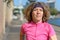 Woman jogging alongside an urban canal or river