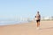 Woman jogging beach