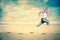 Woman jogging on beach vector