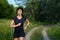 Woman jogging outdoors in forest