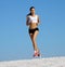 Woman jogging on sand