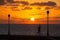 A woman jogging at sunrise on the coast, Caleta de Fuste, Fuerteventura, Canary Islands, Spain