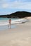 Woman jogging on white beach