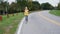 A woman jogs along the path in a beautiful well-groomed park. Front view, steadicam shot