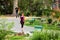 A woman jogs on a city maintained green way trail.