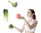 Woman juggle vegetable