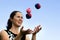 Woman Juggling Balls