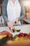 Woman at juice bar cutting Avocado