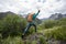 Woman jumping in mountains