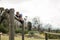 Woman jumping over the hurdles during obstacle course