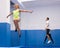 Woman jumping in trampoline center