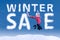 Woman jumping with a winter sale sign